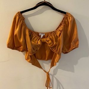 Pretty Garbage front tie cutout crop top.